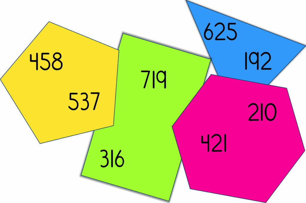 Cut-out paper shapes with numbers written on them for a math early finisher challenge
