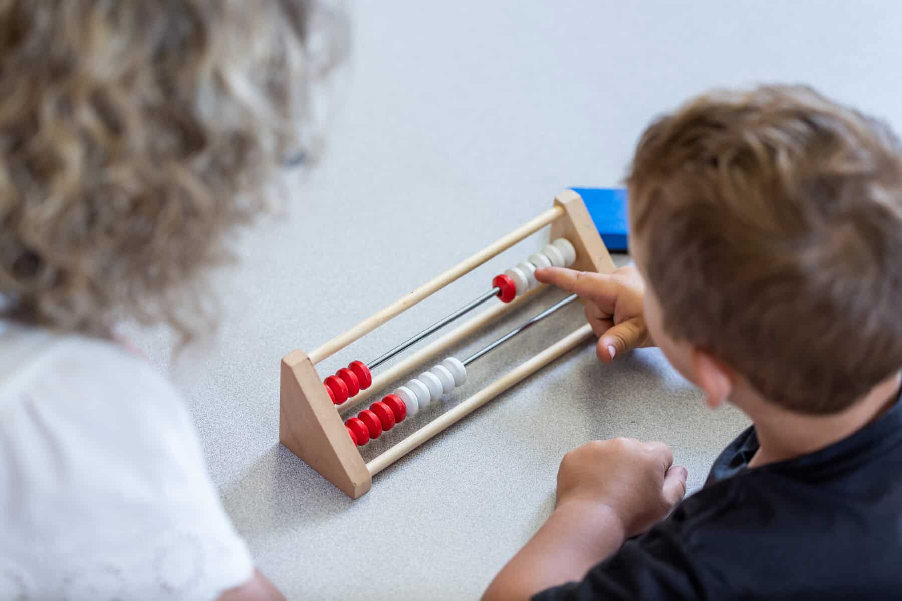 students using a rekenrek counting frame to build number sense during a math lesson